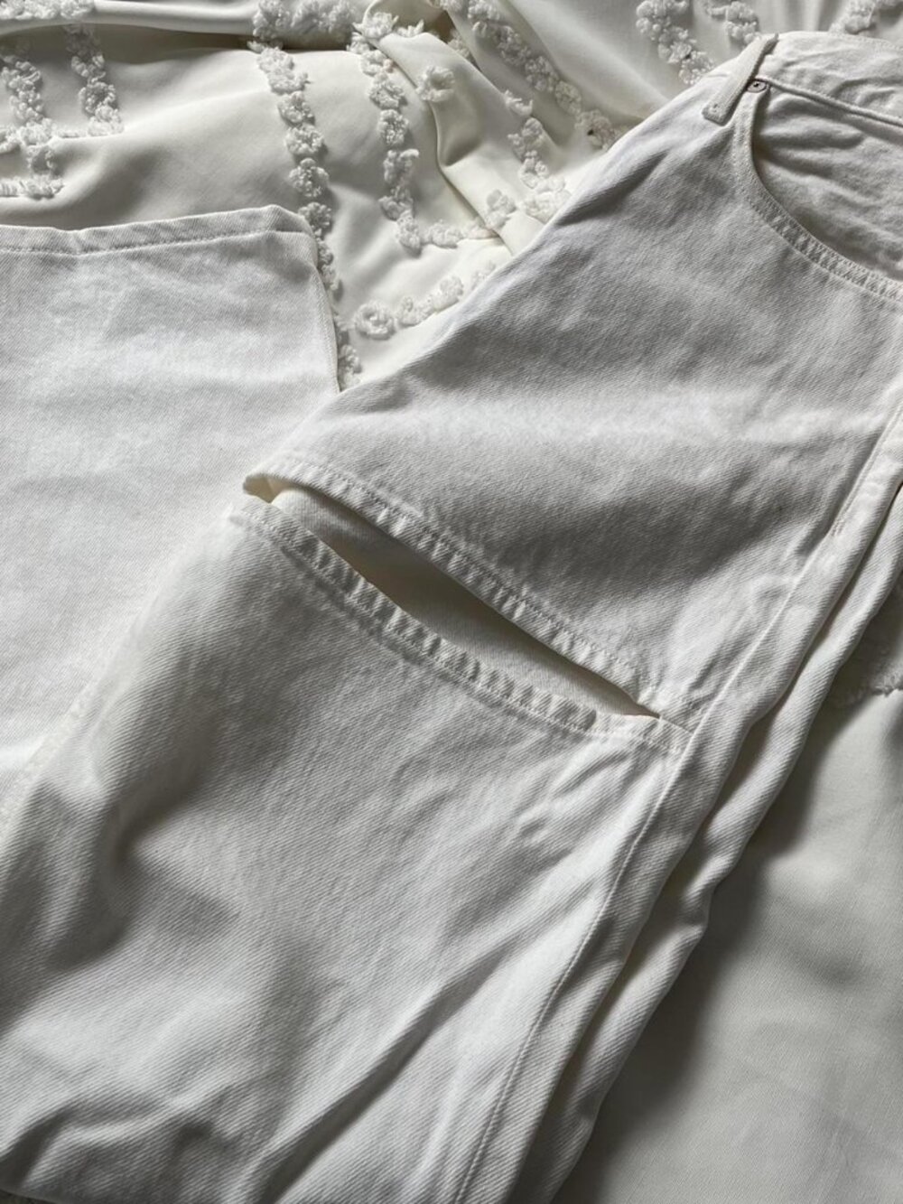 Aritzia white denim jeans with cute streetwear cutout design